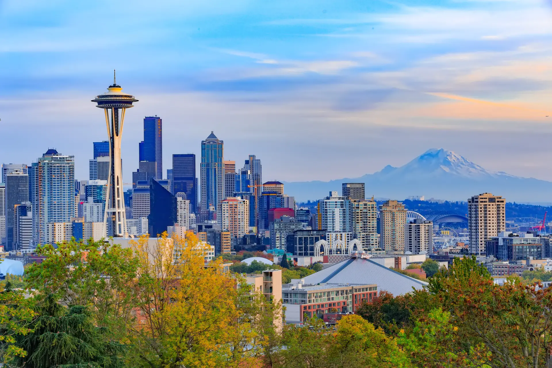 Space Needle and Seattle skyline with mountains in the background