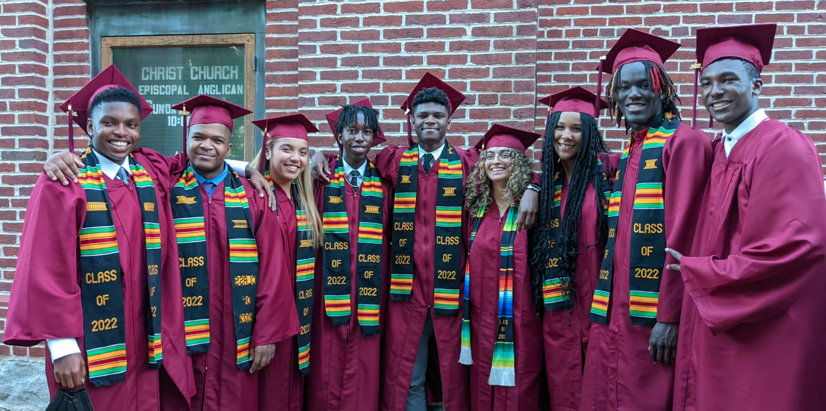 The St. Andrew's Episcopal School social fundraising campaign page featuring graduates in caps and gowns.