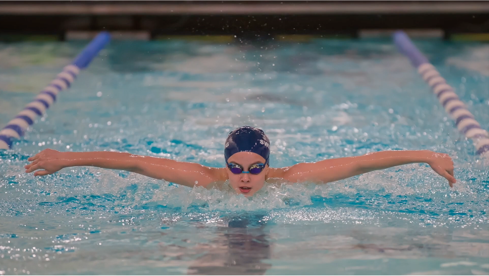 The Pingry School social fundraising page featuring a swimmer in the pool.
