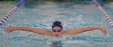 The Pingry School social fundraising page featuring a swimmer in the pool.