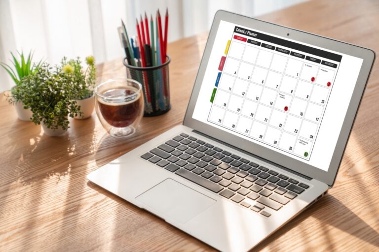 Calendar displayed on laptop for schedule planning.