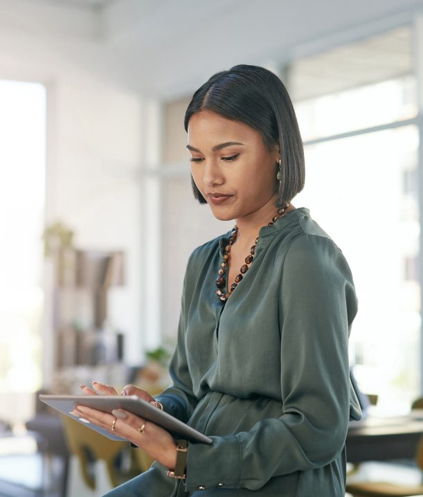A woman accessing a tablet