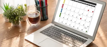 Calendar displayed on laptop for schedule planning.