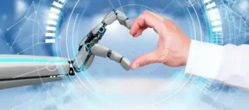 Robot and human hands joined together to form the shape of a heart.