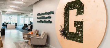 The entryway to GiveCampus headquarters in DC, displaying the company's mission.