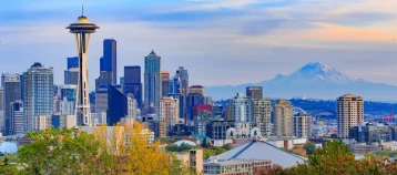 Space Needle and Seattle skyline with mountains in the background