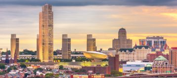Albany, New York, USA downtown city skyline at dusk.