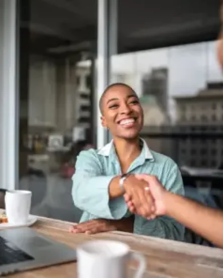 Major gifts officer shaking hands with donor.