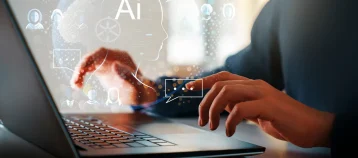 Computer and hands close up. The concept of artificial intelligence and computer technology.