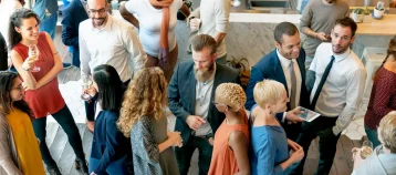 Crowd mingling at alumni event